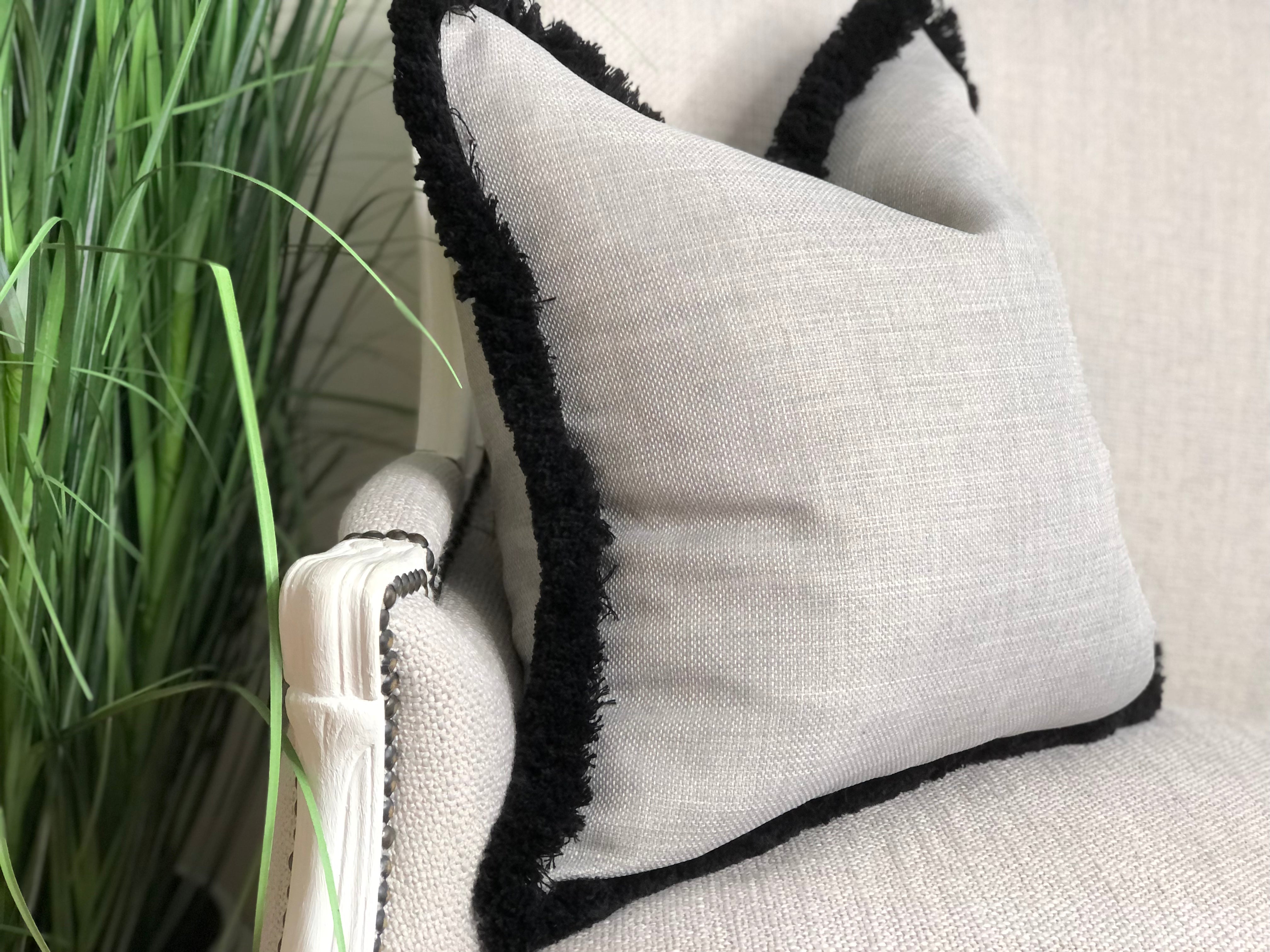 Grey fringe shop cushion