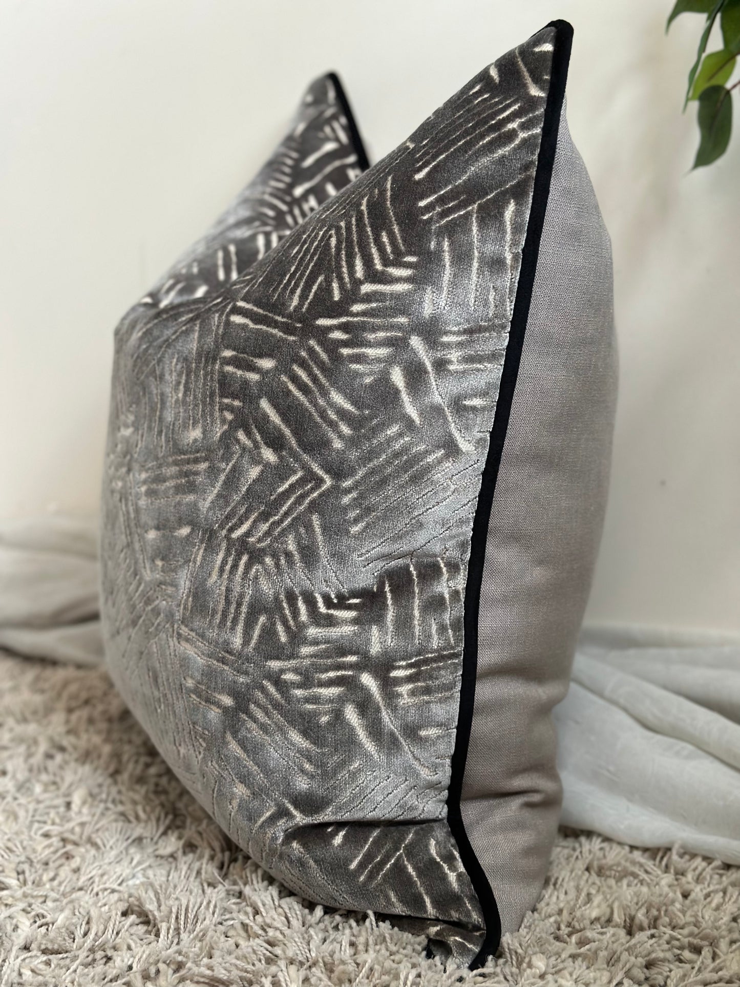 Modern grey pillow with black edge