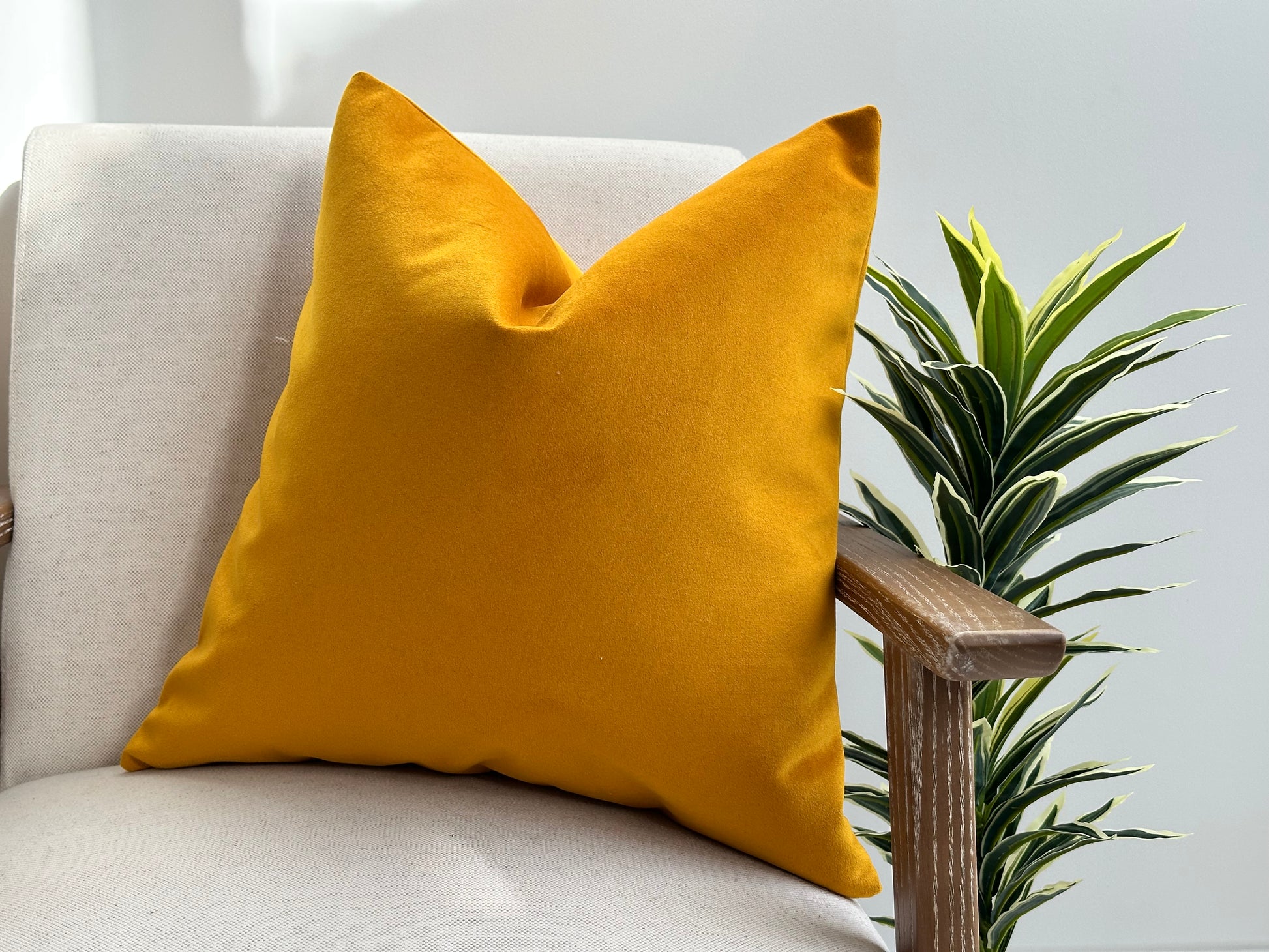 Mustard yellow velvet cushion