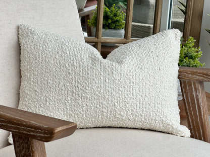 Textured ivory cream boucle rectangle cushion.