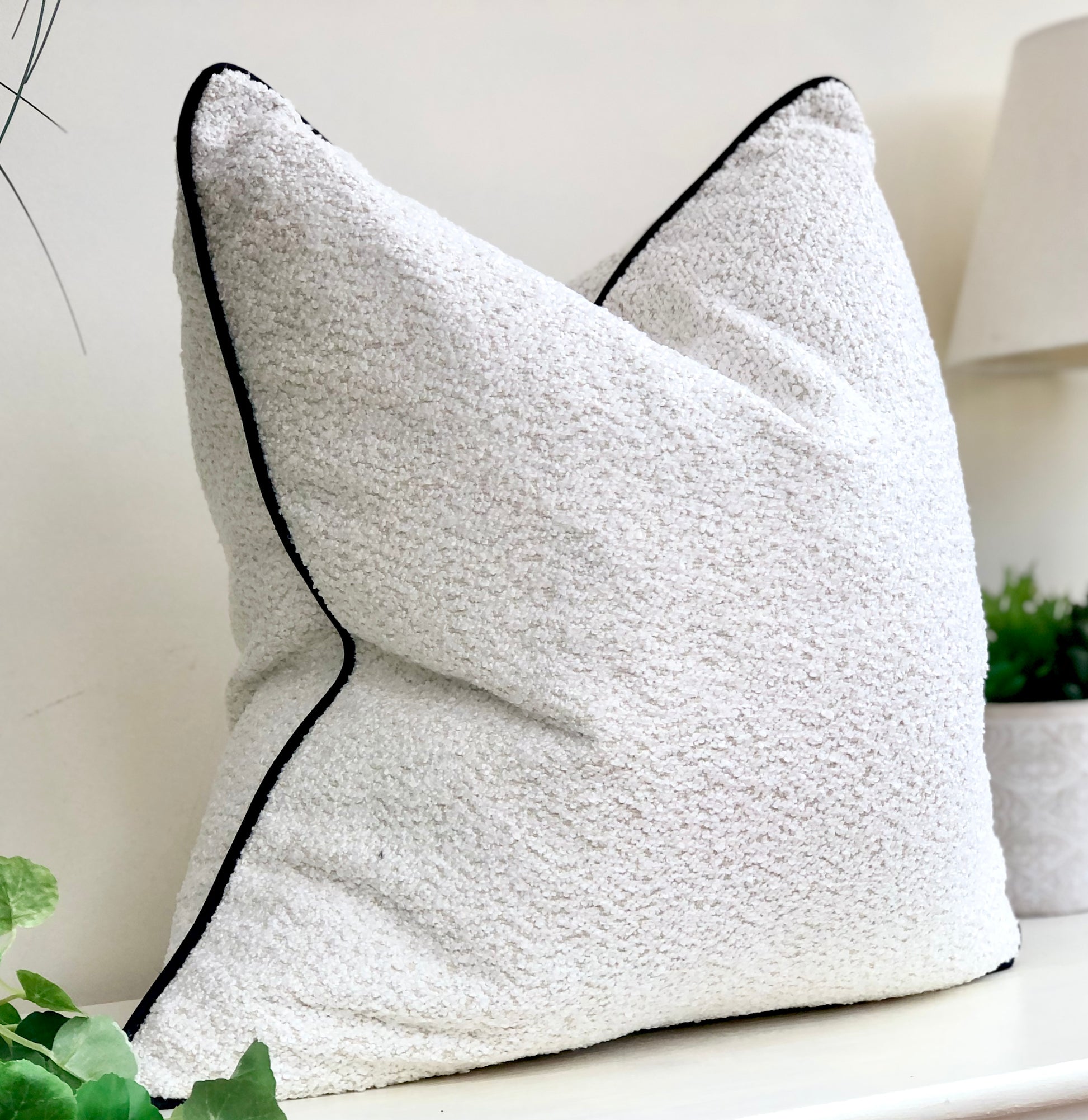 Boucle cushion white black trim 