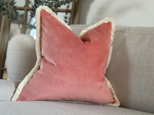 Coral velvet cushion.