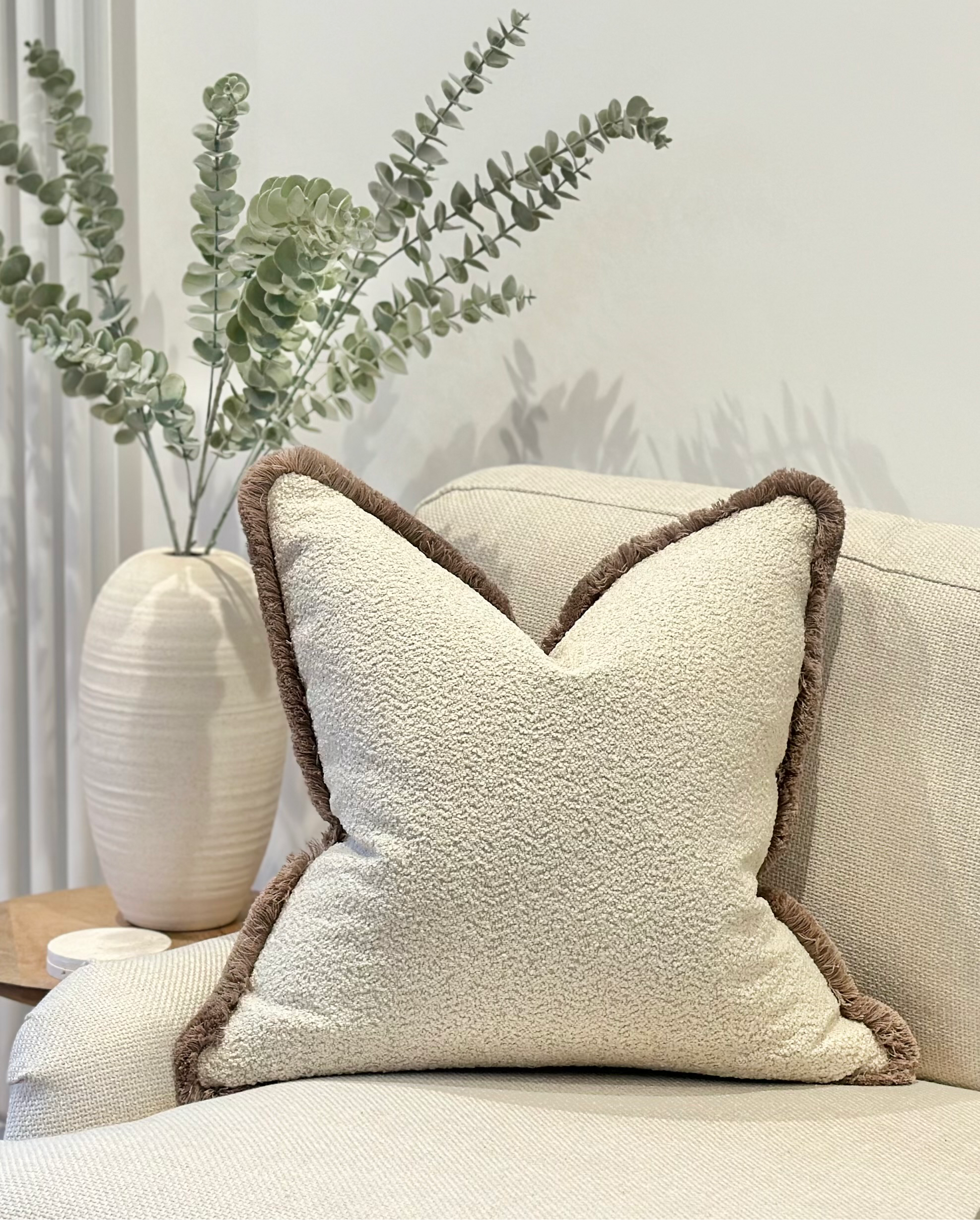 Cream boucle fringed cushion