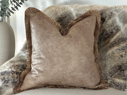 Soft brown colored decorative cushion with textured fringe, perfect for modern farmhouse and bohemian home decor