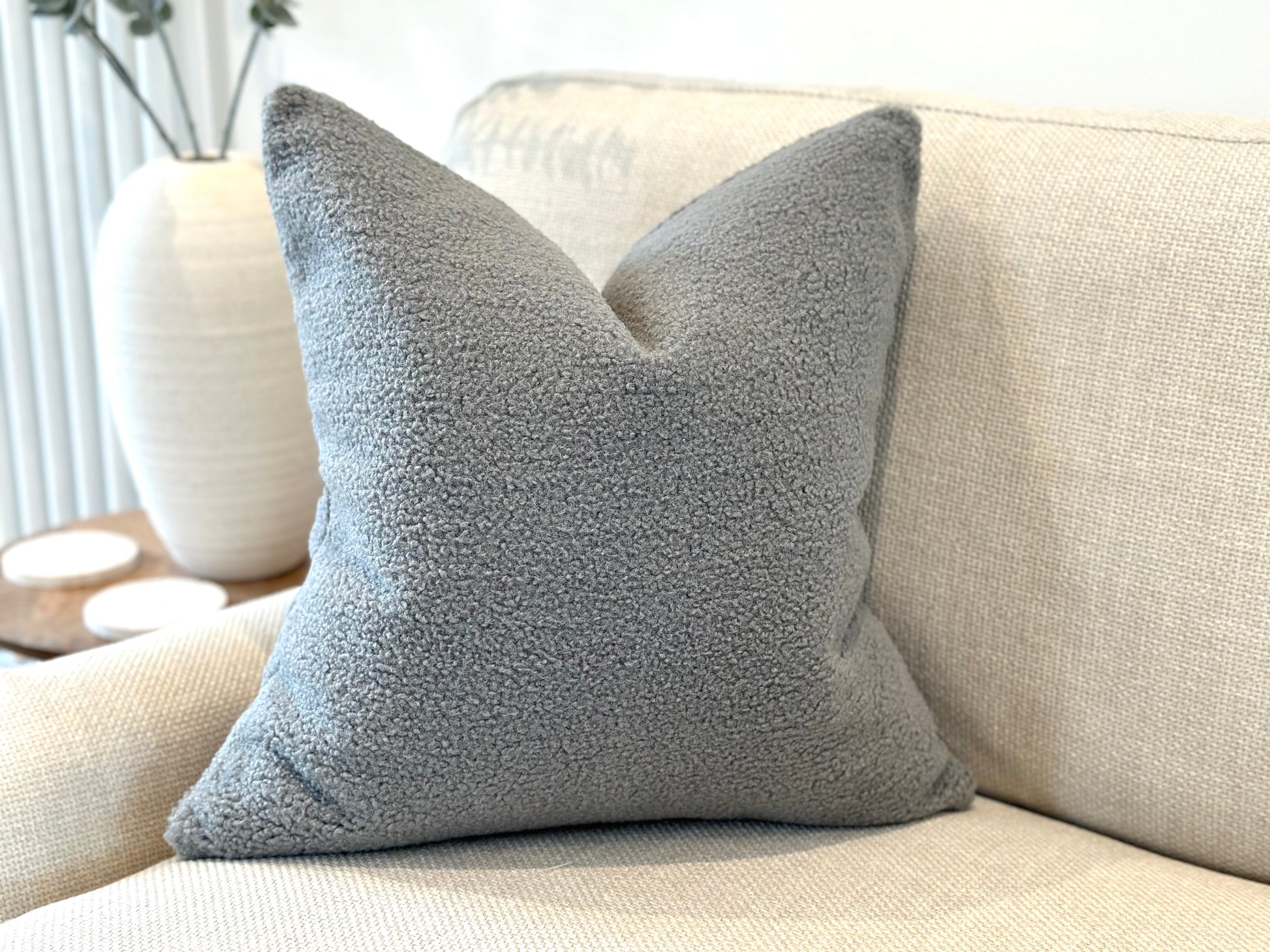 Modern grey textured boucle pillow