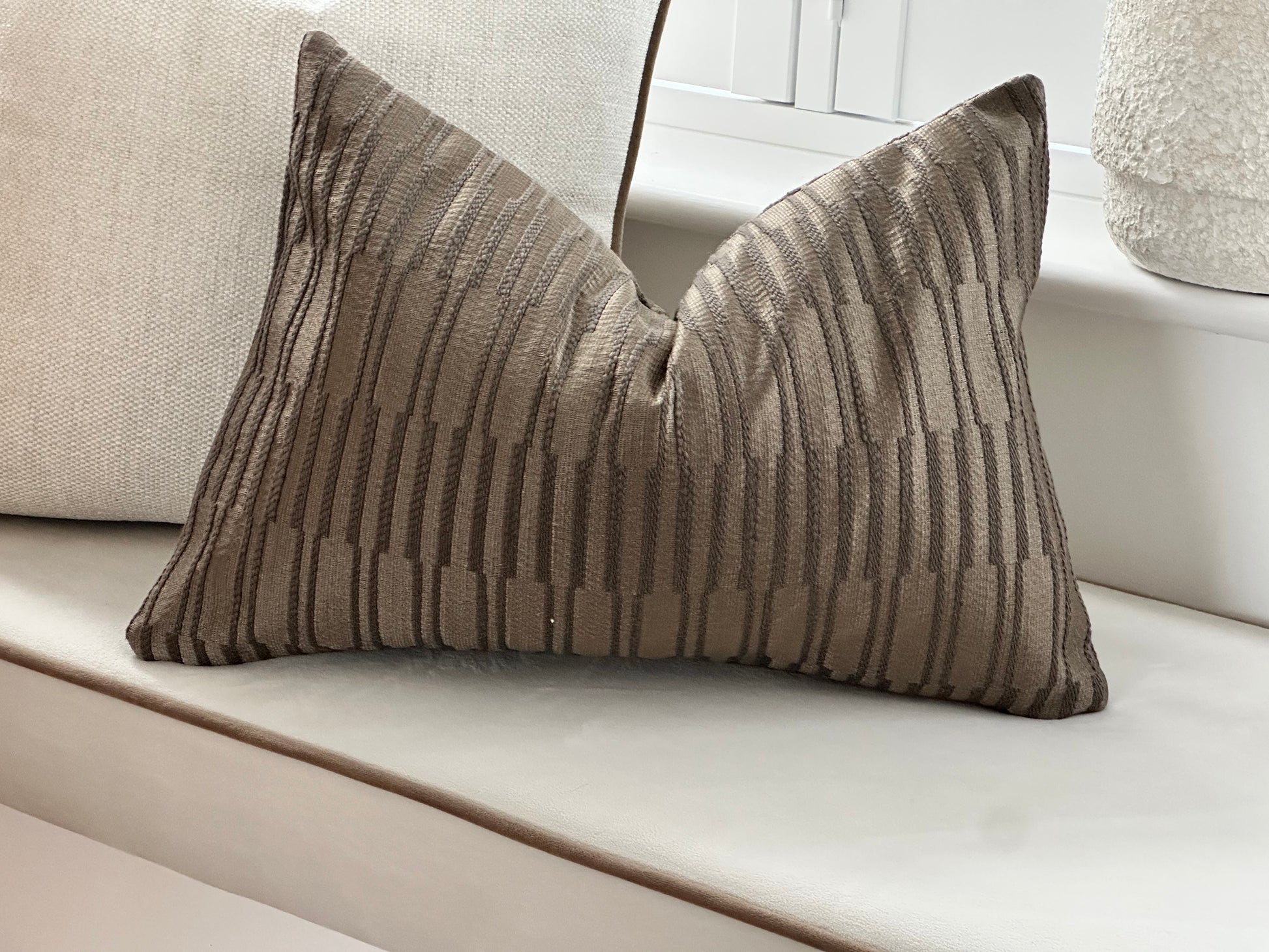 Textured brown lumbar pillow