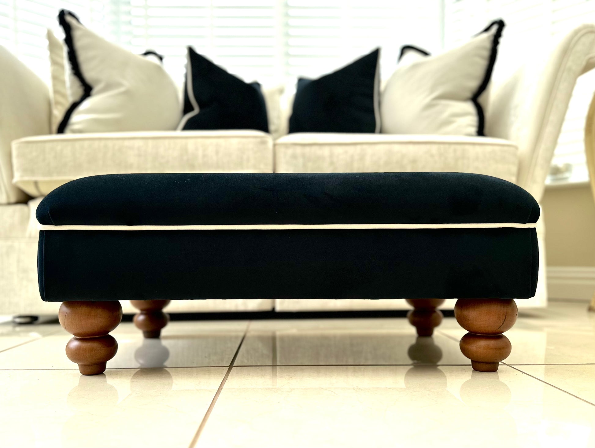 black stool with white trim