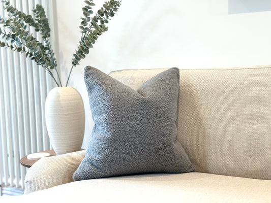 Cosy grey sheep’s fur cushion