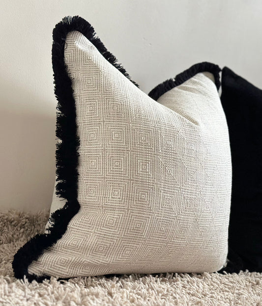 Luxury cream cushion with black fringe 