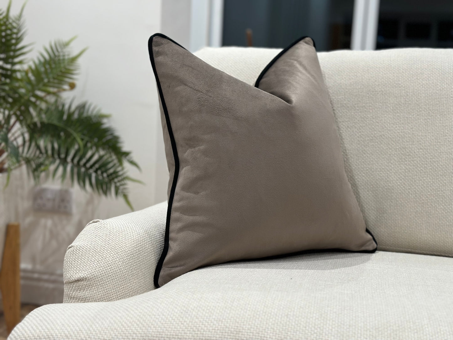 Luxury brown velvet pillow with black trim. Modern home decor