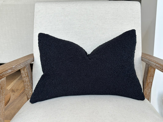 Black boucle rectangle cushion.