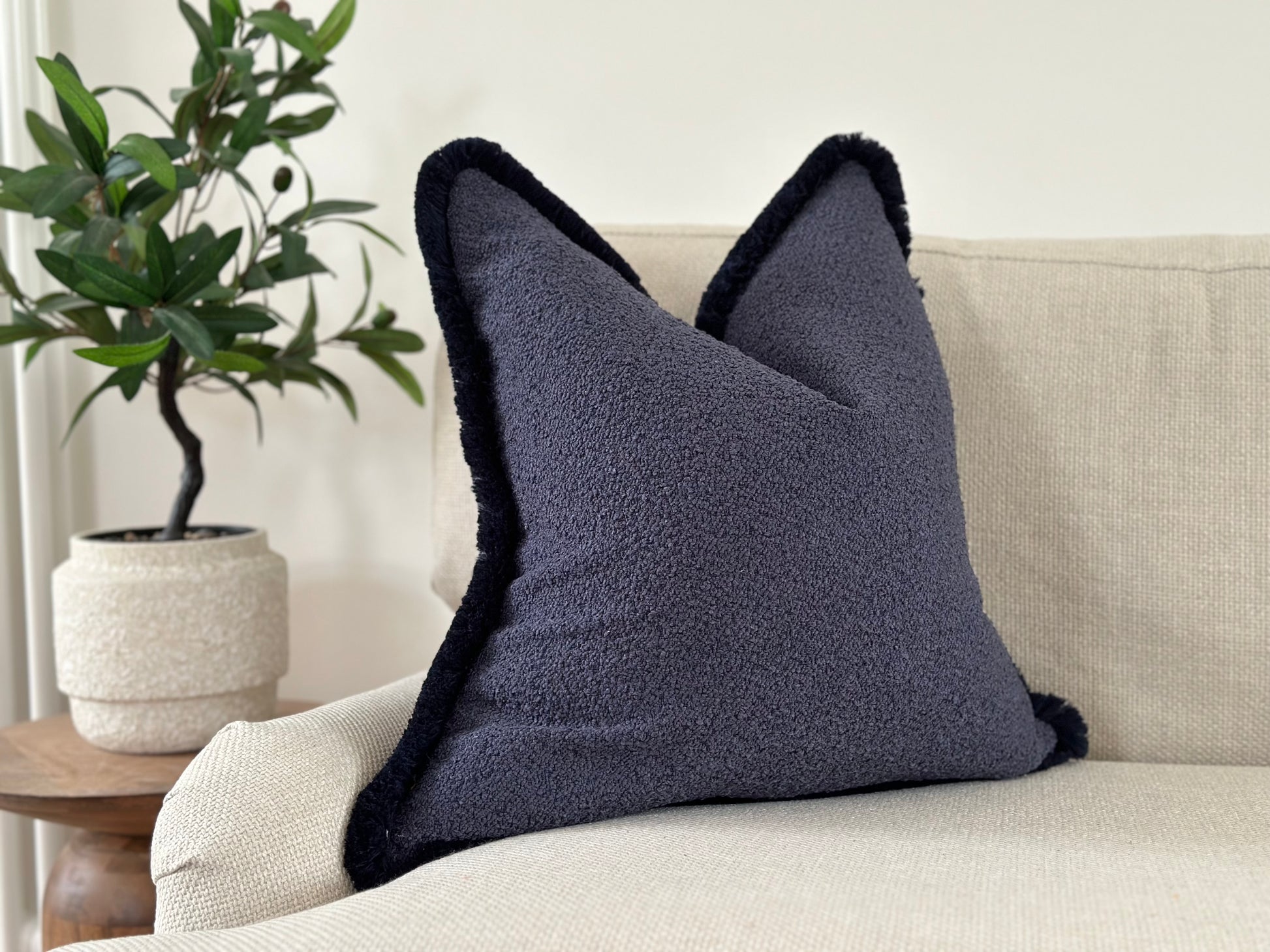 Blue boucle fringe cushion 