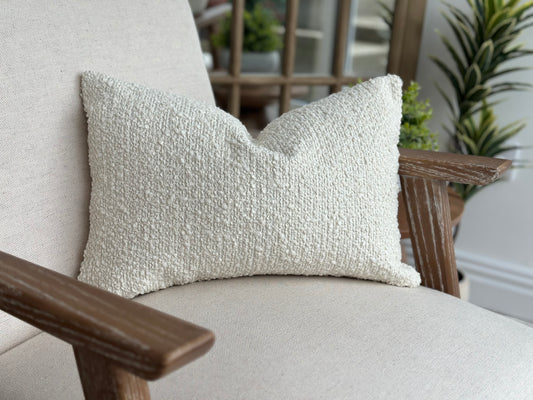 Neutral boucle lumbar cushion.