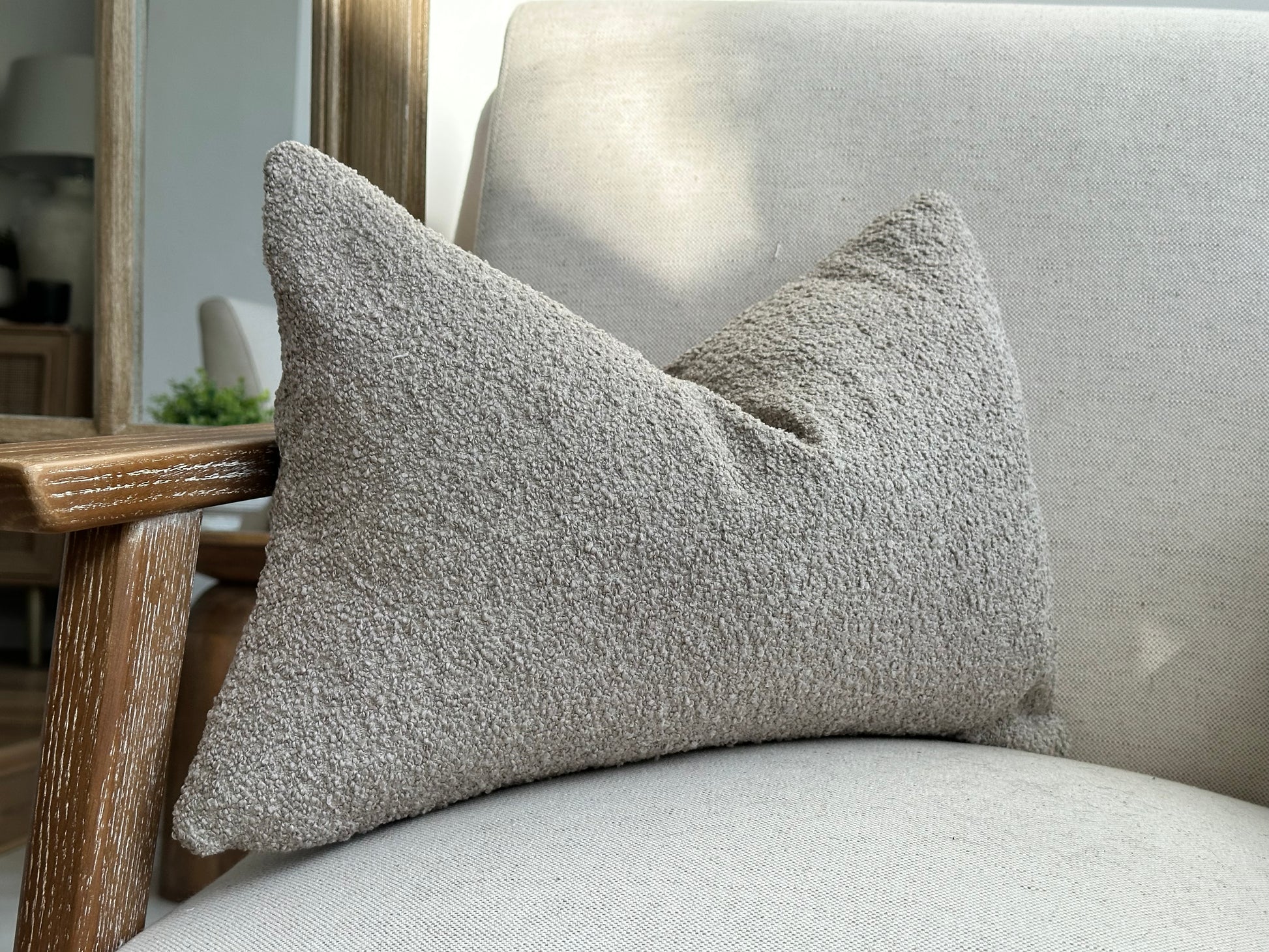 Lumbar stone boucle pillow.