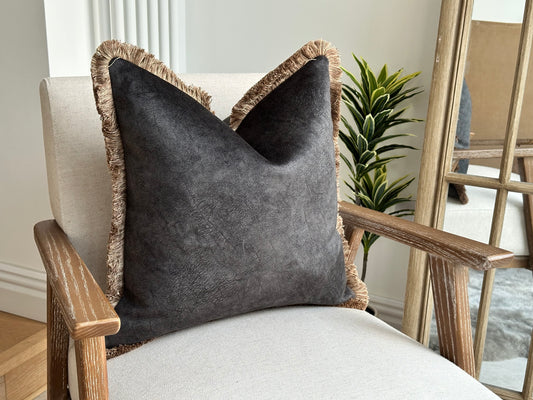 moody black grey hue cushion, pairing beautifully with neutral tones, warm textures, and statement decor.