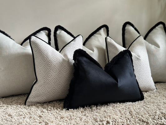 Luxury beige and black modern cushion set for bed or sofa.