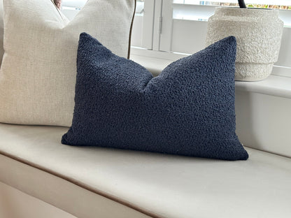 Blue boucle lumbar pillow.