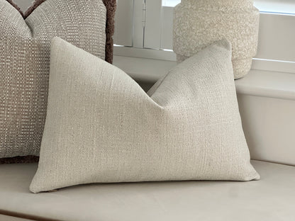 Textured ivory rectangle cushion.