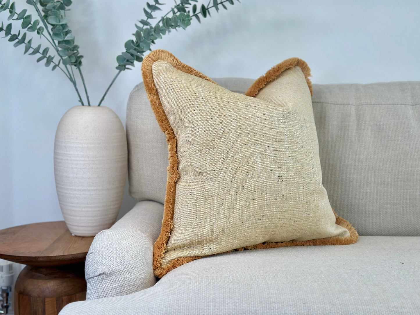 A Beautiful textured pale yellow cushion with fringe. Custom made in all sizes