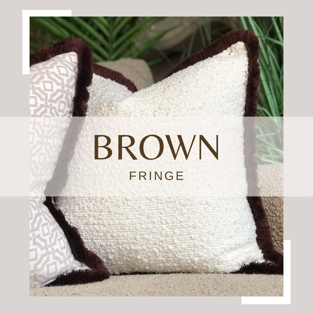 textured ivory cushion with brown frilly edge