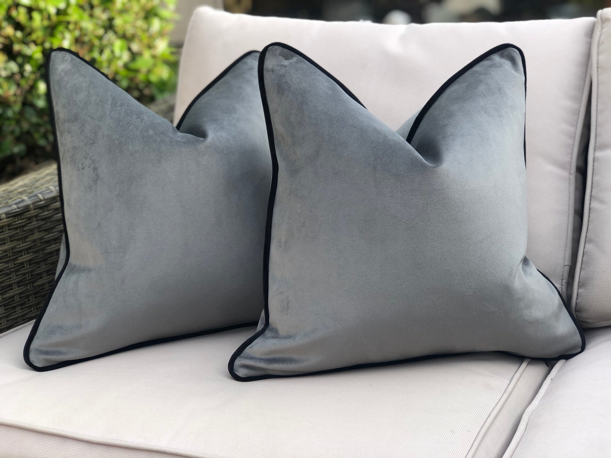 grey cushion with black edging