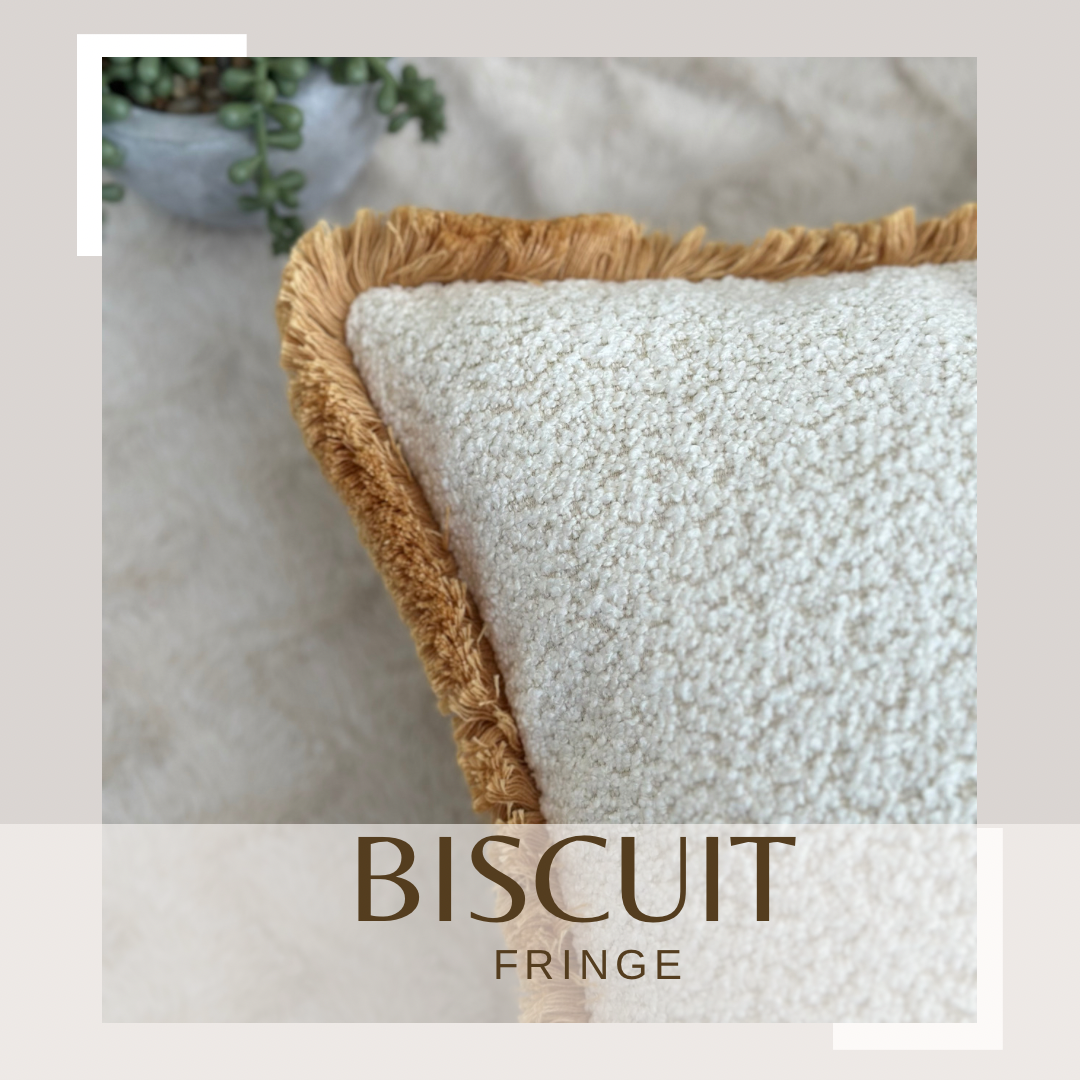 luxury ivory white boucle cushion with fringed boarder 