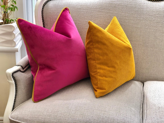 pink cushion with mustard piping