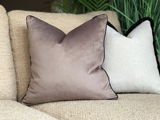 brown cushion with black trim