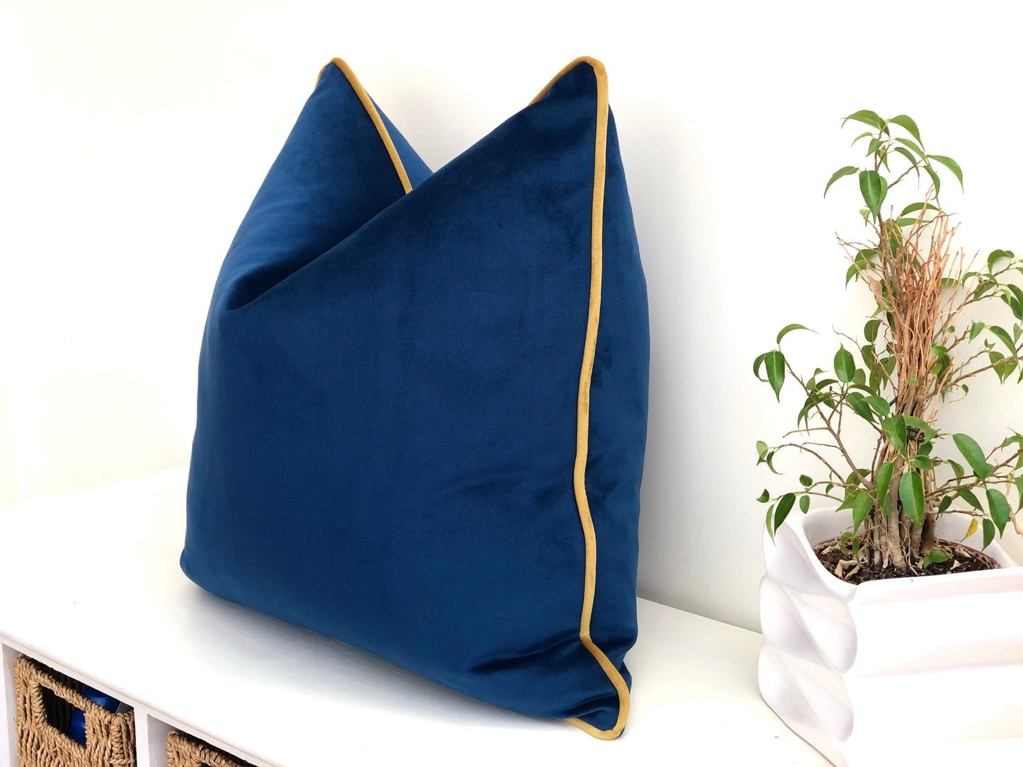 blue and gold velvet cushion