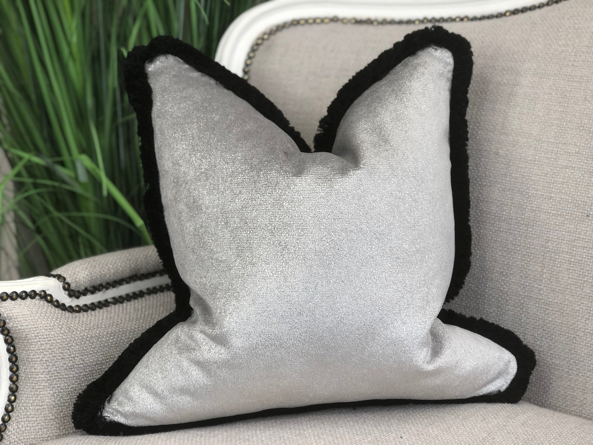 Silver cushion with fringe