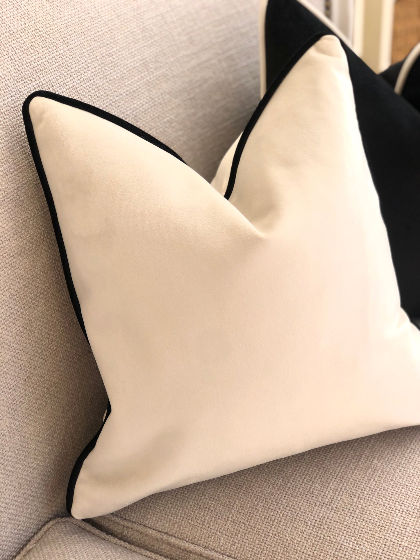 white cushion with black trim