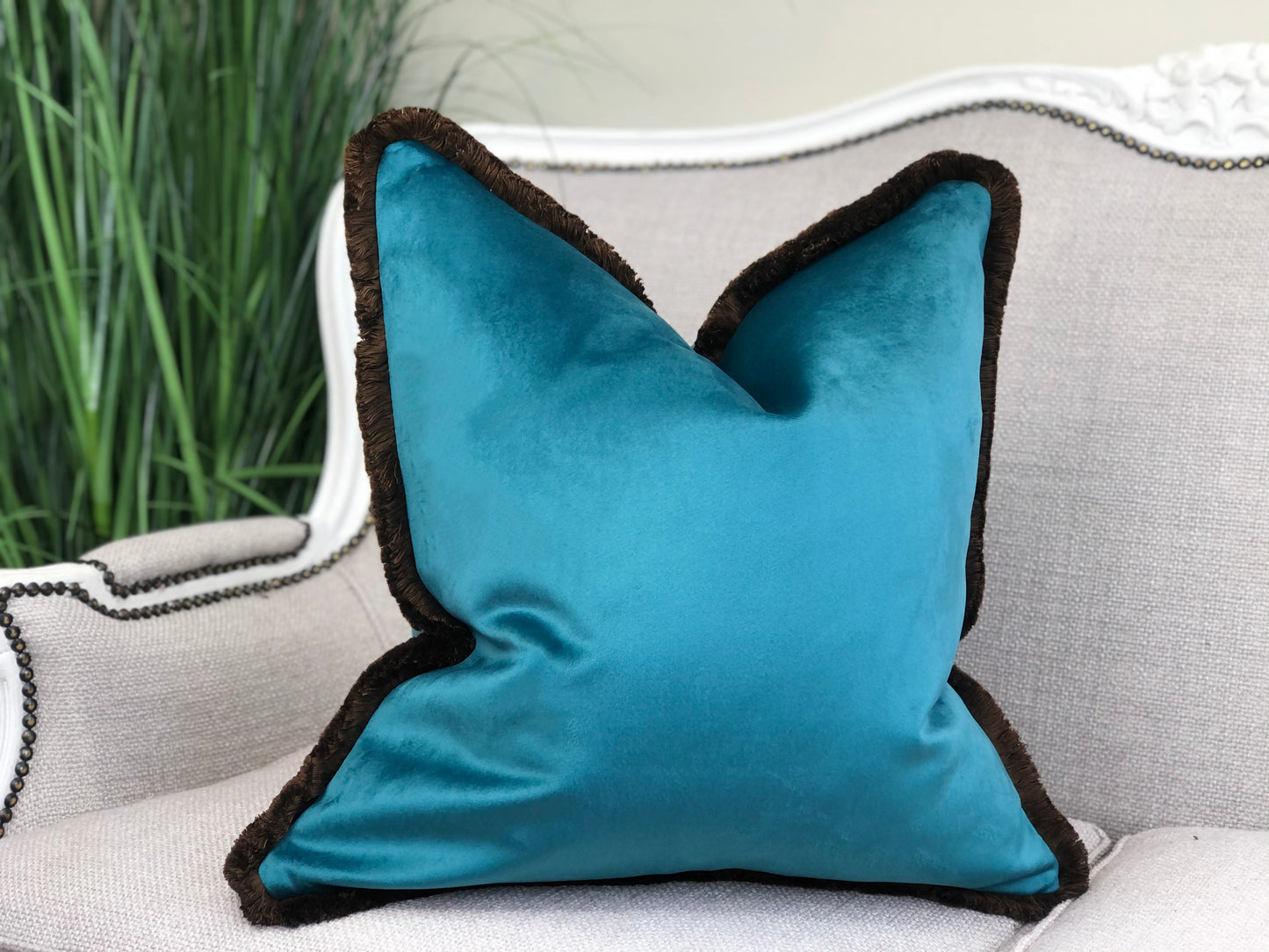 turquoise cushion with fringing