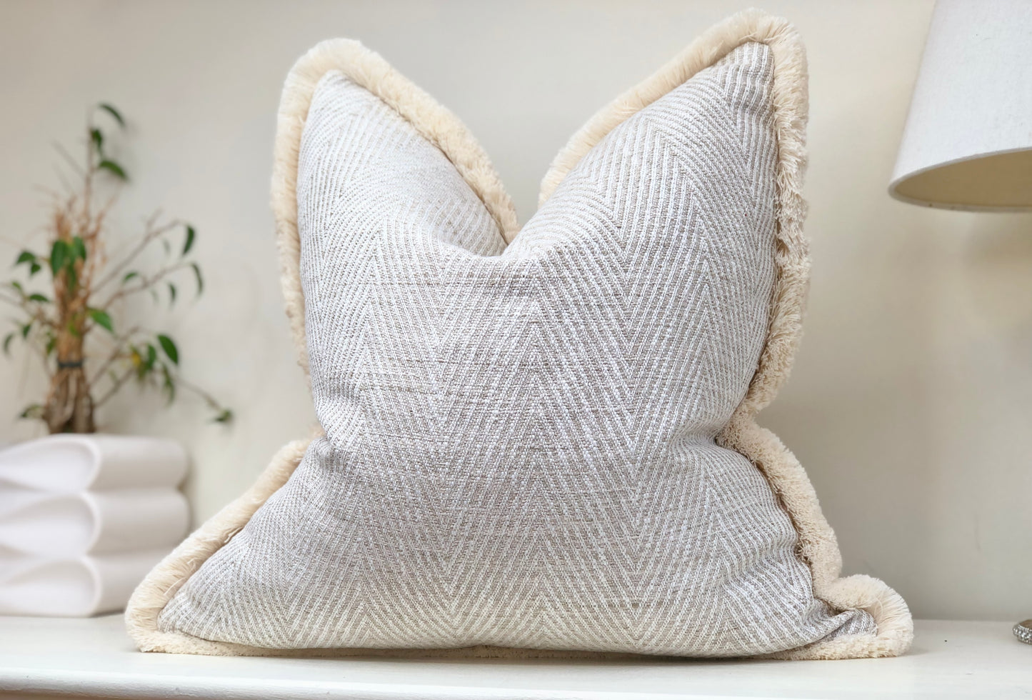 Herringbone cushion with fringe