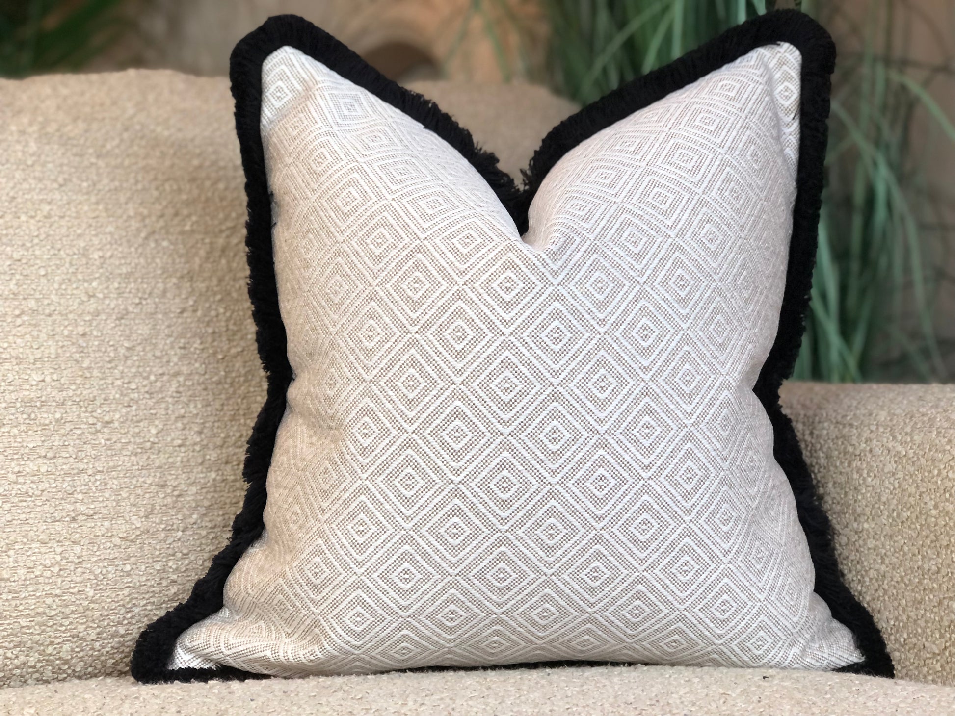 cream cushion with fringe