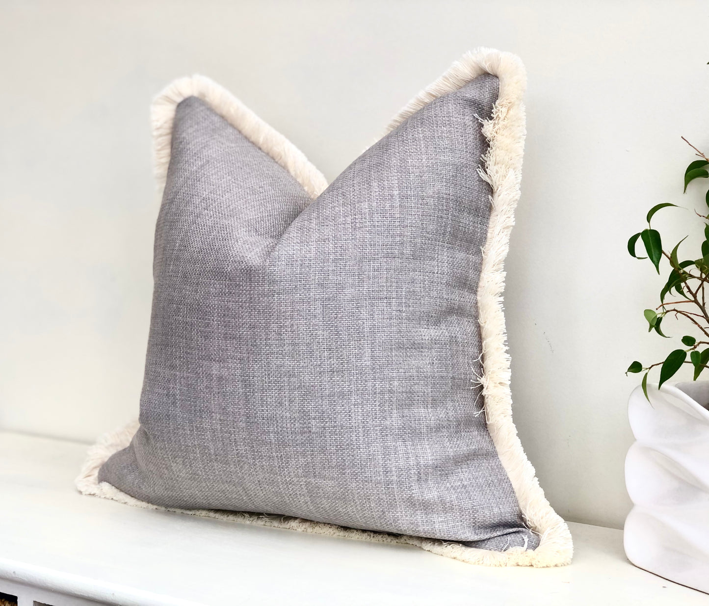 light grey and cream pillow