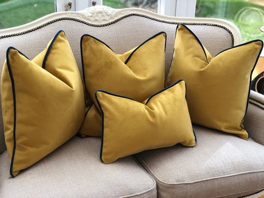 mustard cushion with blue edge