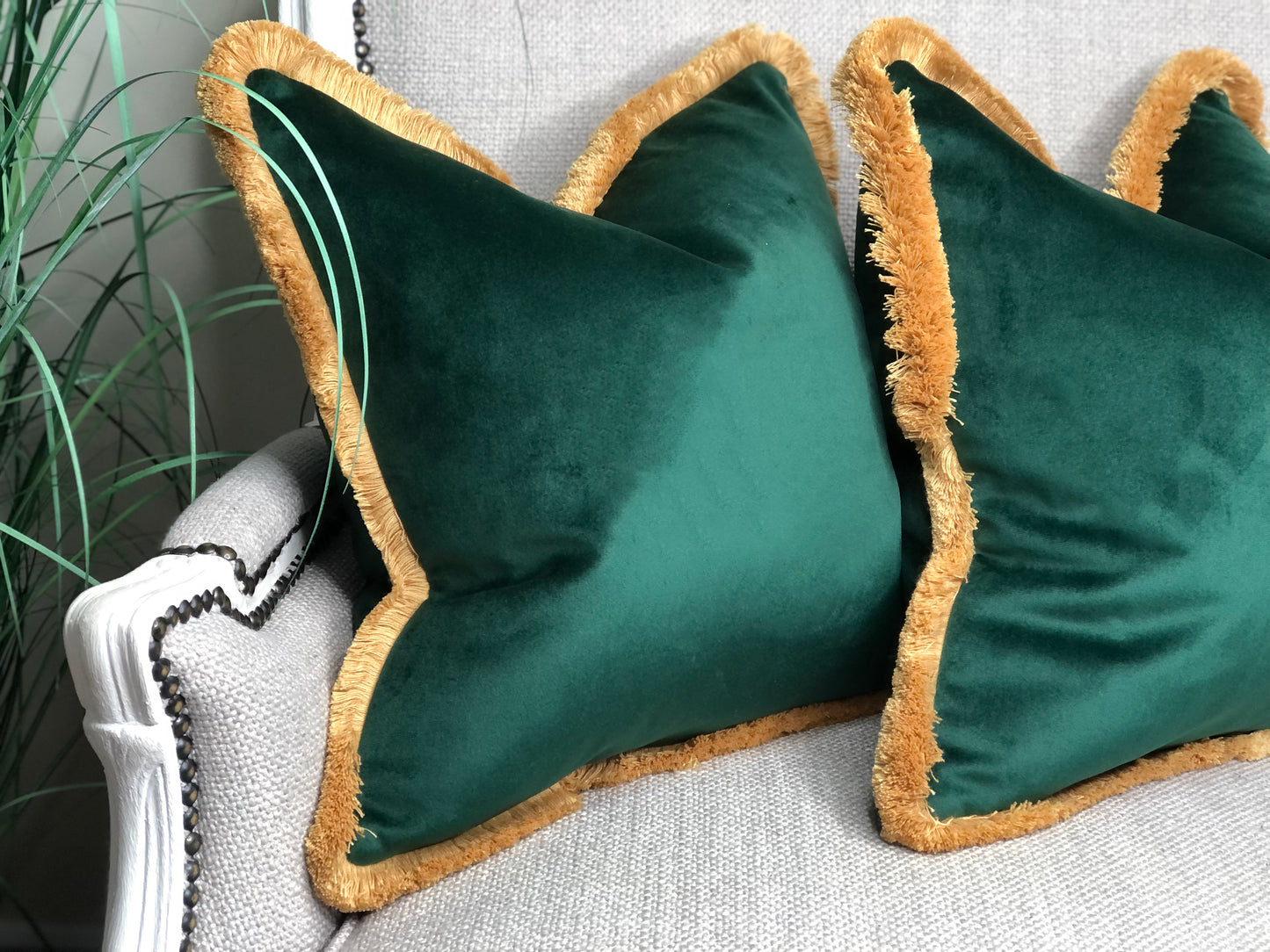 green fringed cushion