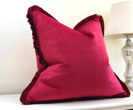 red cushion with fringe